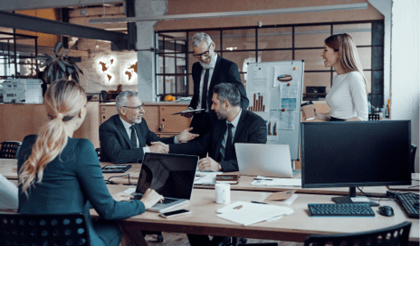 Modern marketing professionals in elegant formalwear discussing fresh business ideas while working in the office              