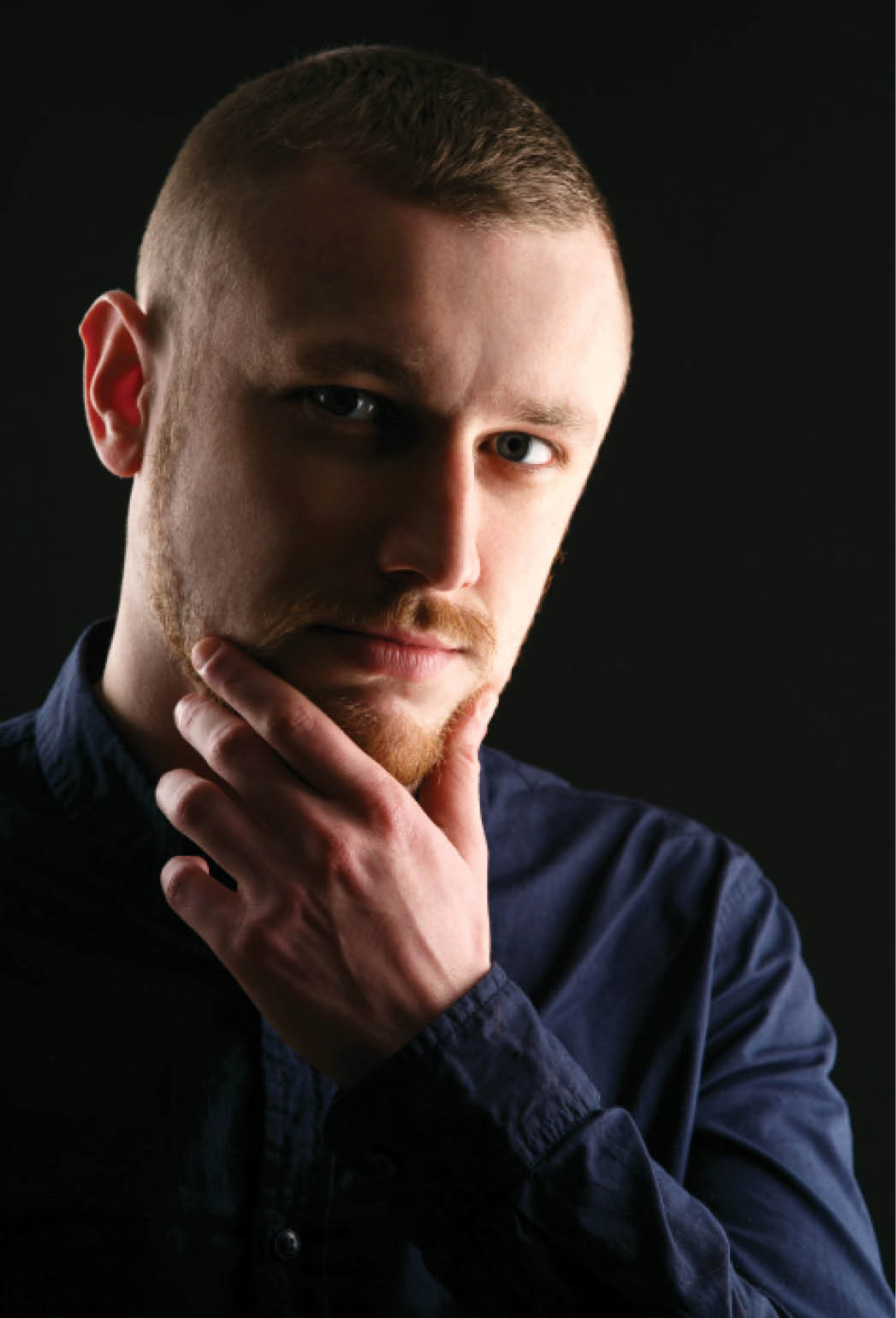 Calm face of bearded man with blue eyes