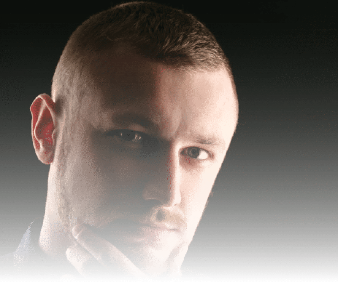 Calm face of bearded man with blue eyes