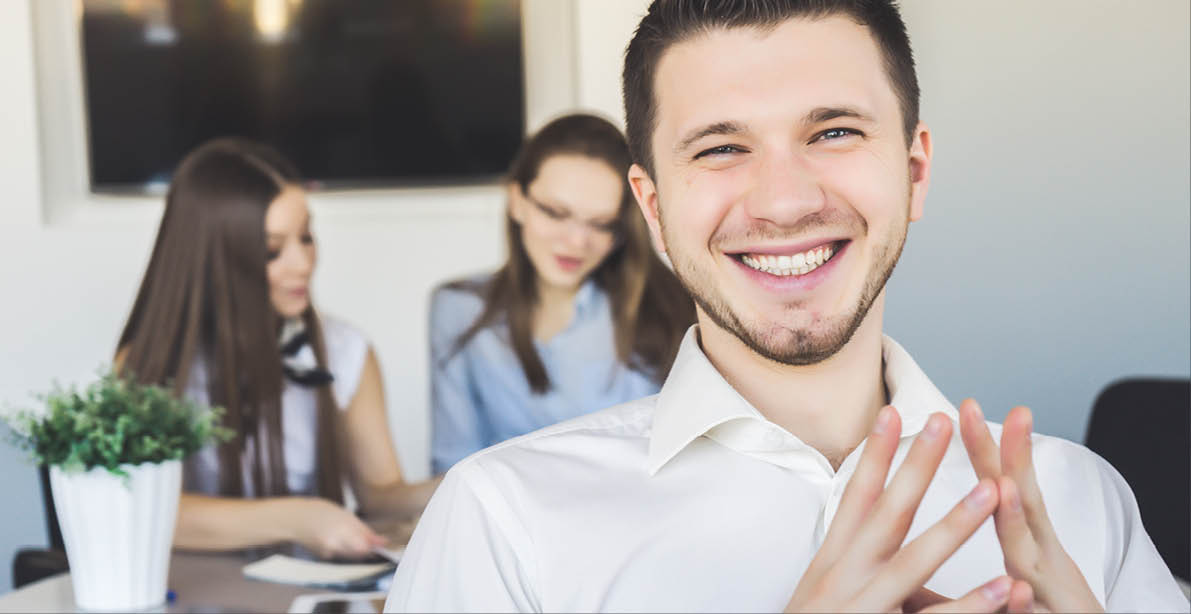 Happy smiling office worker male,man in suit sitting,conference.Handsome teacher