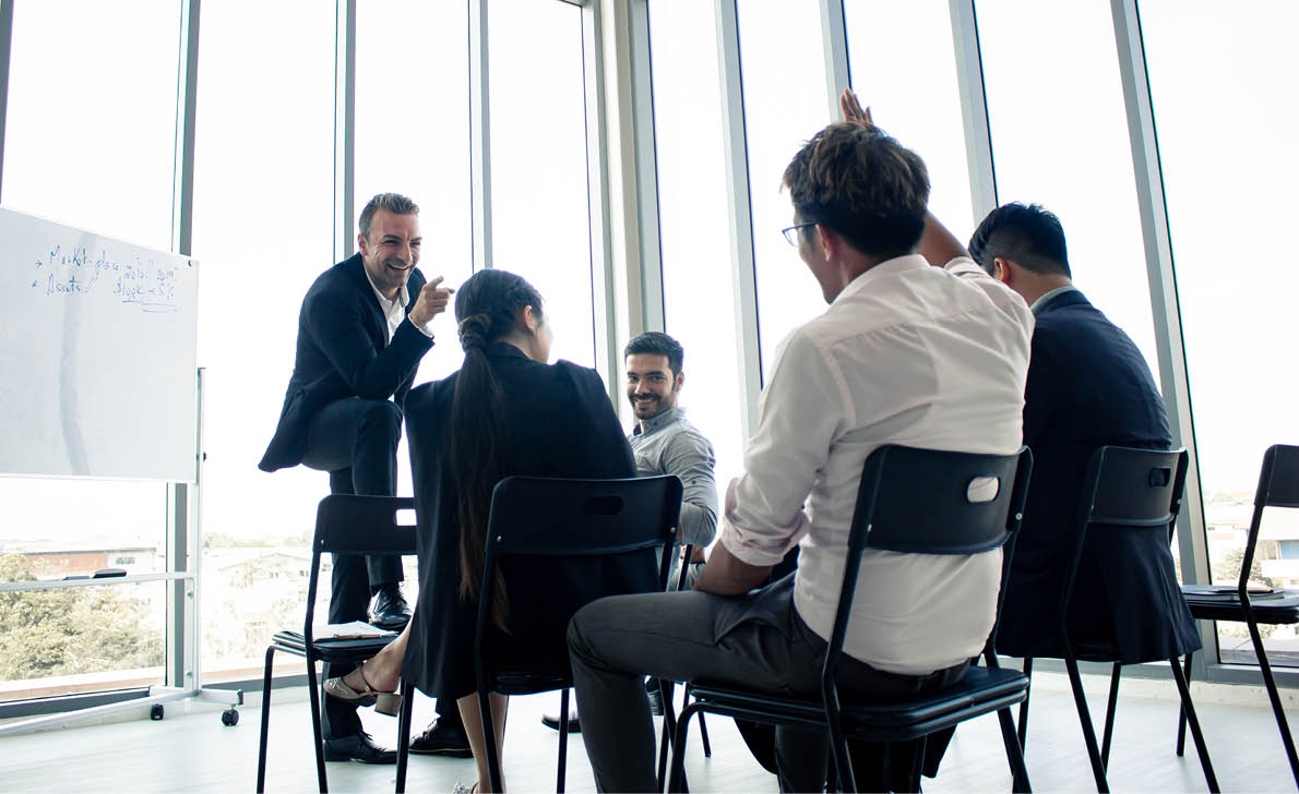 Employees raise their hands to inquire about the work in the company. Chief answers questions to those are suspected in the meeting.